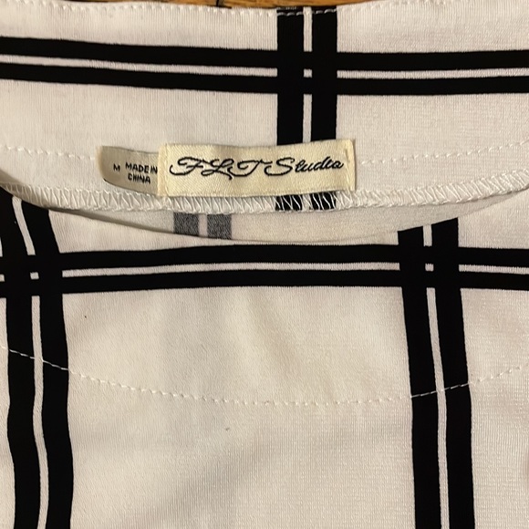 White and Black Blouse. Short Sleeve. Size Medium. Cute detail and pattern! - Picture 2 of 3